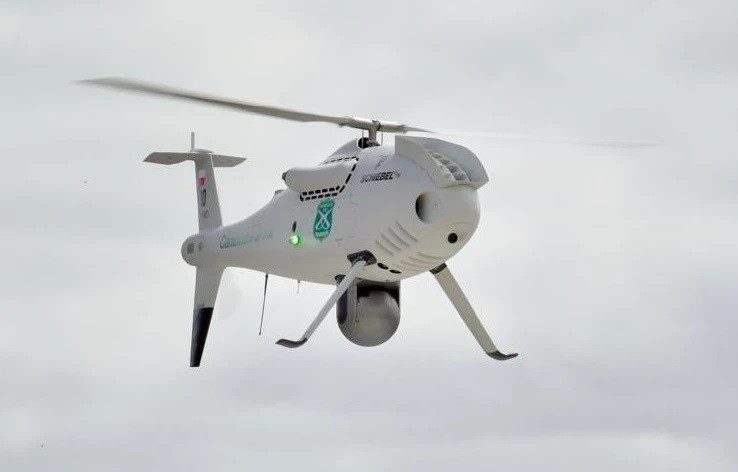 UAS VTOL Schiebel Camcopter S 100 número C 30 con el sistema TrakkaCam TC 300 en su exhibición aérea. Firma Ministerio del Interior y Seguridad Pública de Chile 002